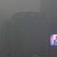 A big screen flashes commercials on the exterior of an office building in Xi’an, in northwest China